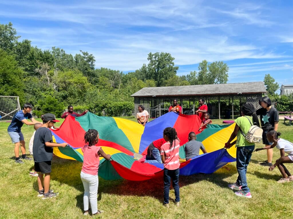 Children playing with parachute